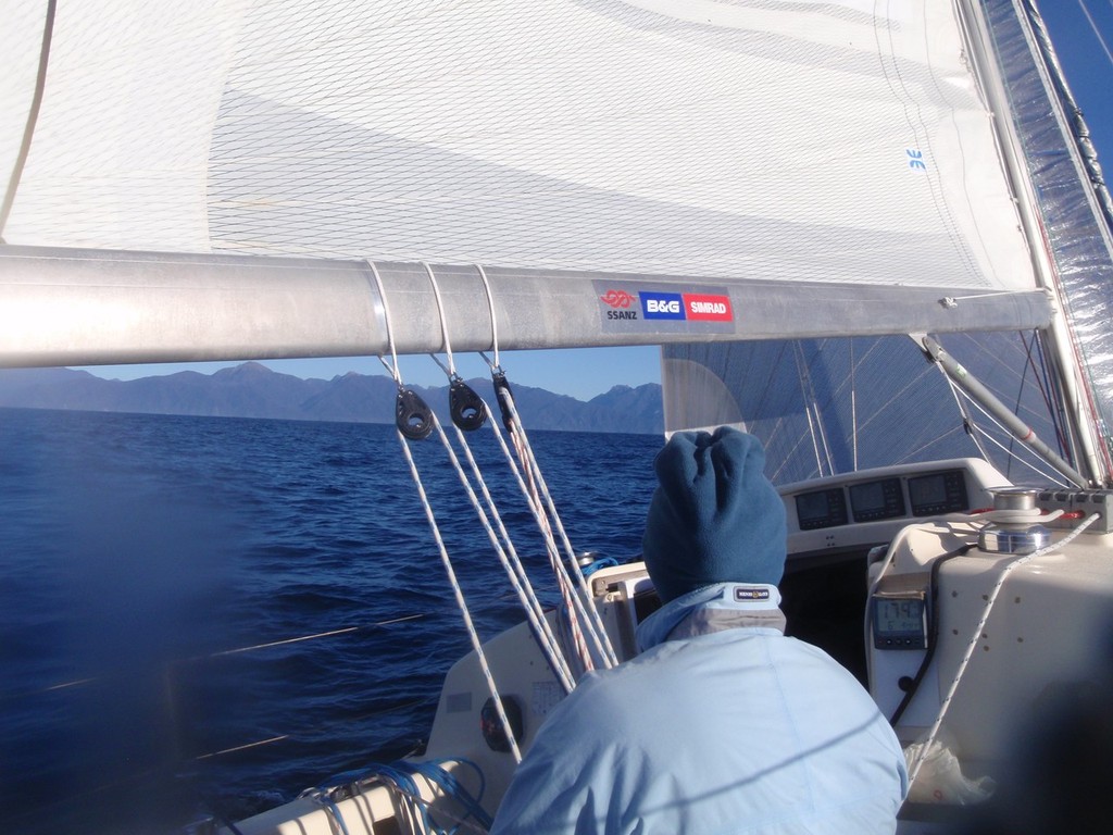 Sally steers close to Dusky Sound - 2012 Two Handed Round New Zealand Race - Expedition Coppelia © SW