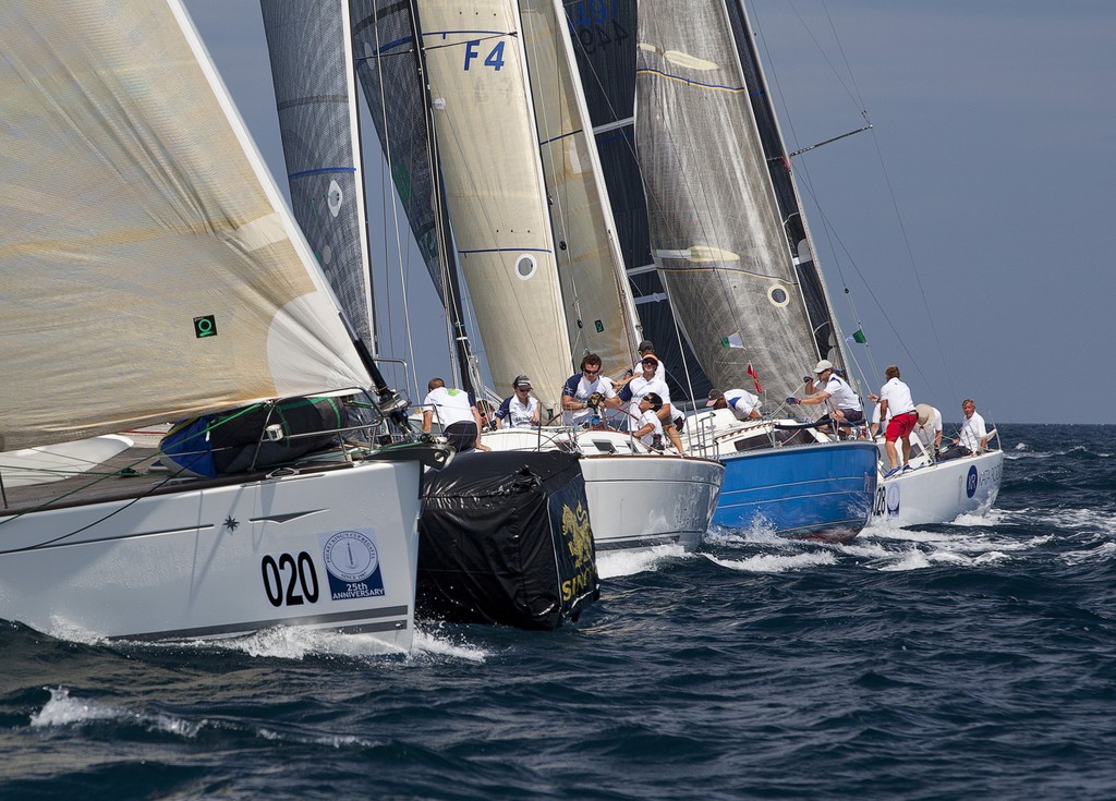 Phuket King’s Cup Regatta 2011 -  traffic at the leeward mark. Feeling, by a nose from Skandia Endeavour of Whitby, Piccolo and Team Kata Rocks © Guy Nowell http://www.guynowell.com