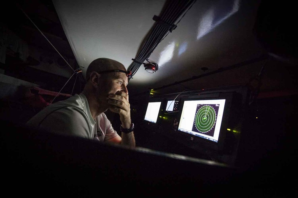 Tom Addis studies the radar from the nav station, looking for a way out of the large rain cloud right in the middle. Onboard PUMA Ocean Racing powered by BERG during leg 6 of the Volvo Ocean Race 2011-12, from Itajai, Brazil, to Miami, USA. (Credit: Amory Ross/PUMA Ocean Racing/Volvo Ocean Race) photo copyright Amory Ross/Puma Ocean Racing/Volvo Ocean Race http://www.puma.com/sailing taken at  and featuring the  class