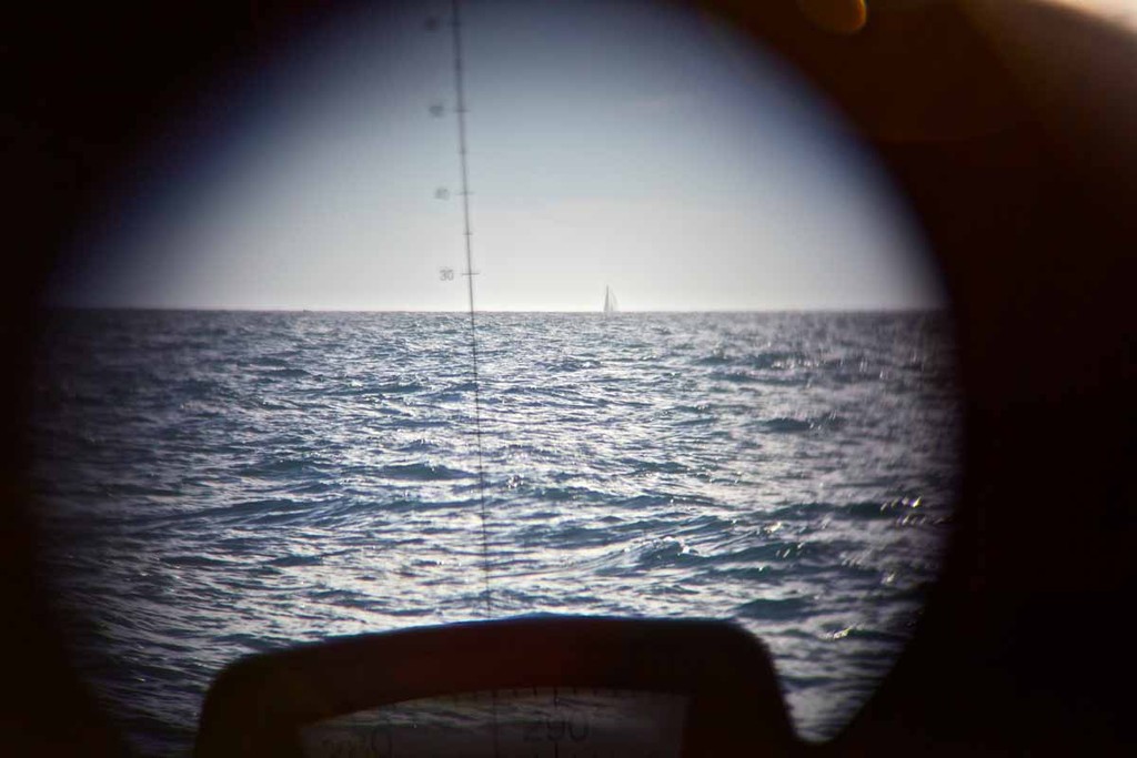 Groupama approaches, bearing 287-degrees, as seen through a pair of binoculars. PUMA Ocean Racing powered by BERG during leg 5 of the Volvo Ocean Race 2011-12, from Auckland, New Zealand, to Itajai, Brazil. (Credit: Amory Ross/PUMA Ocean Racing/Volvo Ocean Race) photo copyright Amory Ross/Puma Ocean Racing/Volvo Ocean Race http://www.puma.com/sailing taken at  and featuring the  class