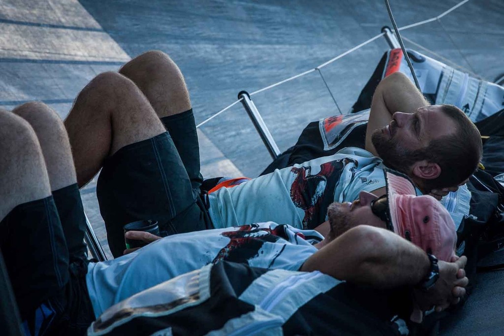 Ryan Godfrey (far) and Tom Addis (close) relax to leeward in calm sailing conditions. Onboard PUMA Ocean Racing powered by BERG during leg 6 of the Volvo Ocean Race 2011-12 © Amory Ross/Puma Ocean Racing/Volvo Ocean Race http://www.puma.com/sailing