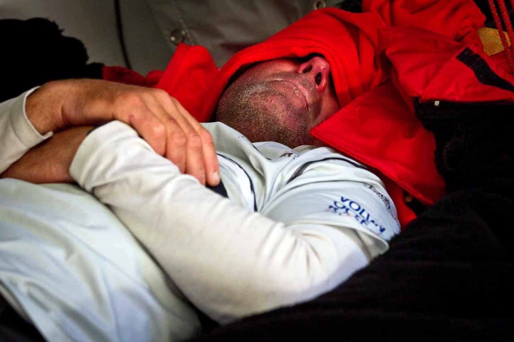 Jono Swain catches up on some much needed sleep while hiding under his fleece. PUMA Ocean Racing powered by BERG during leg 5 of the Volvo Ocean Race 2011-12, from Auckland, New Zealand to Itajai, Brazil. © Amory Ross/Puma Ocean Racing/Volvo Ocean Race http://www.puma.com/sailing