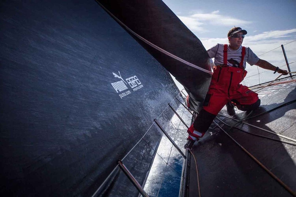 Kelvin Harrap helps take down a sail on the bow. Onboard PUMA Ocean Racing powered by BERG during leg 6 of the Volvo Ocean Race 2011-12, from Itajai, Brazil, to Miami, USA. (Credit: Amory Ross/PUMA Ocean Racing/Volvo Ocean Race) photo copyright Amory Ross/Puma Ocean Racing/Volvo Ocean Race http://www.puma.com/sailing taken at  and featuring the  class