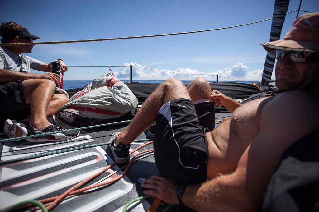 Kelvin Harrap and Ryan Godfrey relax on the sail-less bow during difficult drifting conditions. Onboard PUMA Ocean Racing powered by BERG during leg 6 of the Volvo Ocean Race 2011-12 © Amory Ross/Puma Ocean Racing/Volvo Ocean Race http://www.puma.com/sailing