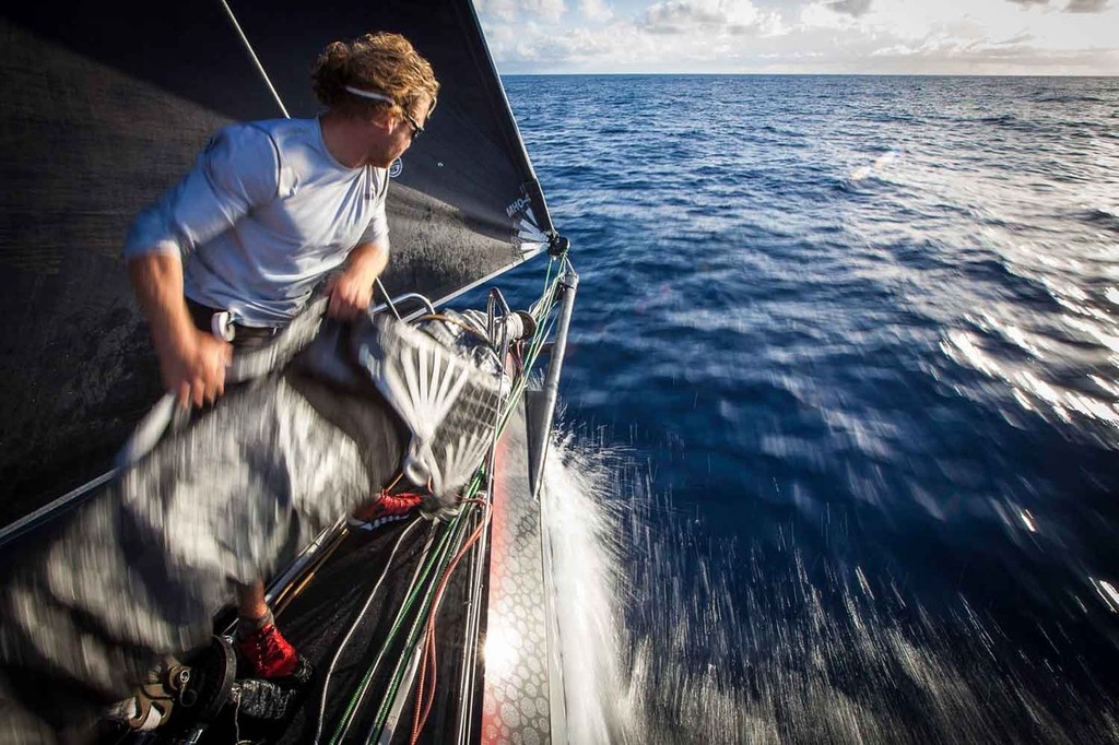 Michi Müller drags the tack of the A5 downwind runner forward onto the bowsprit before peeling to it from the big Code-0. Onboard PUMA Ocean Racing powered by BERG during leg 6 of the Volvo Ocean Race 2011-12, from Itajai, Brazil, to Miami, USA. (Credit: Amory Ross/PUMA Ocean Racing/Volvo Ocean Race) photo copyright Amory Ross/Puma Ocean Racing/Volvo Ocean Race http://www.puma.com/sailing taken at  and featuring the  class