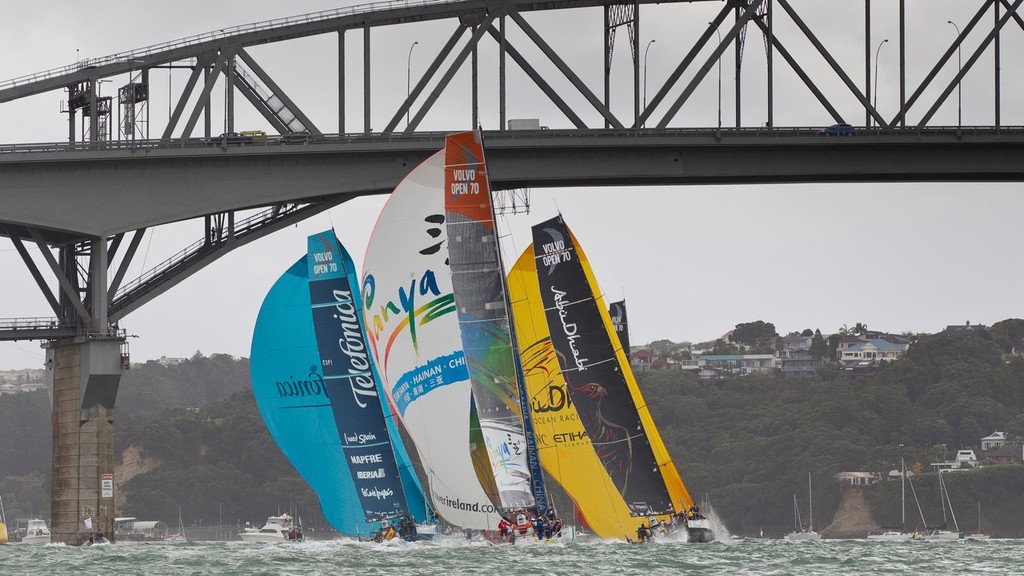 Team Telefonica, Team Sanya and Abu Dhabi Ocean Racing fly their spinnakers as they sail under Auckland Harbour Bridge, during the Auckland In-Port Race, in the Volvo Ocean Race 2011-12. (Credit: IAN ROMAN/Volvo Ocean Race) - Volvo Ocean Race, In Port Race, Auckland March 17, 2012 photo copyright Ian Roman/Volvo Ocean Race http://www.volvooceanrace.com taken at  and featuring the  class