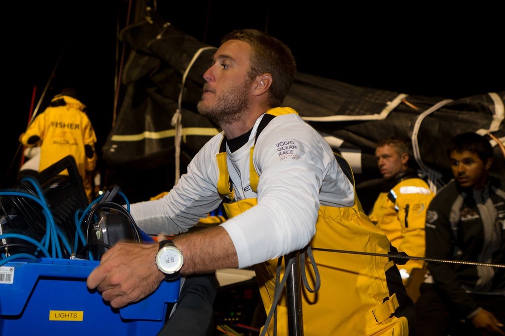 MCM Nick Dana carrying some lights to have a better view of the damage onboard Abu Dhabi Ocean Racing after they returned to the port  during the start of leg 5 of the Volvo Ocean Race 2011-12, from Auckland, New Zealand to Itajai, Brazil.(Credit: IAN ROMAN/Volvo Ocean Race) photo copyright Ian Roman/Volvo Ocean Race http://www.volvooceanrace.com taken at  and featuring the  class