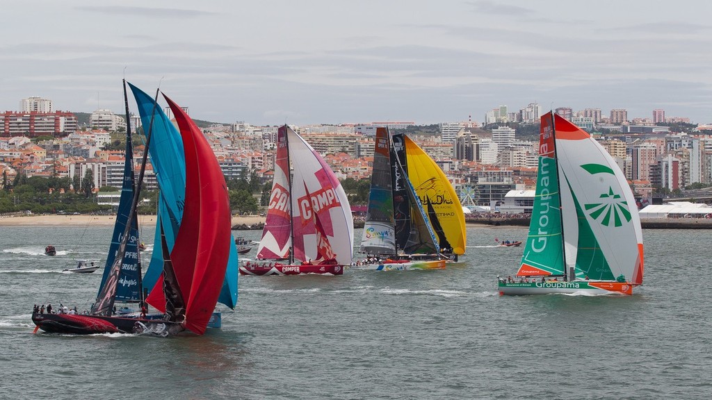 3 - Puma in tern luffs to keep clear of Telefonica (blue sails) after  the start of the Oeiras In-Port Race in Lisbon, during the Volvo Ocean Race 2011-12. (Credit: IAN ROMAN/Volvo Ocean Race) photo copyright Ian Roman/Volvo Ocean Race http://www.volvooceanrace.com taken at  and featuring the  class