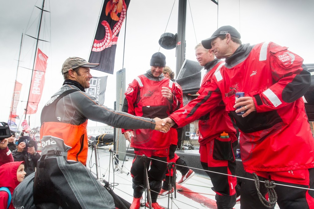 Thomas Coville from France shakes the hand of Brad Jackson from New Zealand, as Puma Ocean Racing take third place on leg 8, from Lisbon, Portugal to Lorient, France, during the Volvo Ocean Race 2011-12.  © Ian Roman/Volvo Ocean Race http://www.volvooceanrace.com