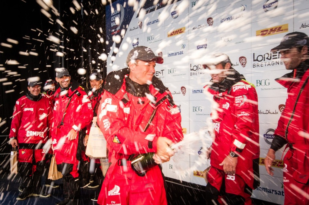 Camper with Emirates Team New Zealand’s Nick Burridge from New Zealand sprays champagne, after taking second place on leg 8, from Lisbon, Portugal to Lorient, France, during the Volvo Ocean Race 2011-12.  © Ian Roman/Volvo Ocean Race http://www.volvooceanrace.com