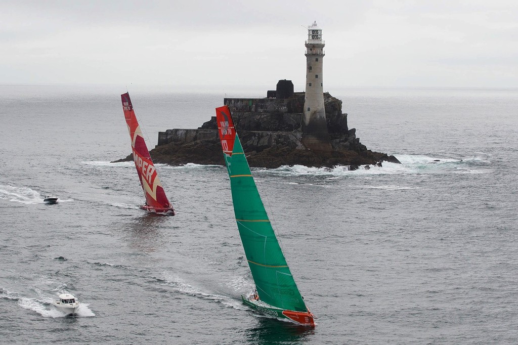 Groupama Sailing Team, skippered by Franck Cammas from France and CAMPER with Emirates Team New Zealand, skippered by Chris Nicholson from Australia, rounding the Fastnet Rock on leg 9 of the Volvo Ocean Race 2011-12, from Lorient, France to Galway, Ireland. (Credit: IAN ROMAN/Volvo Ocean Race) photo copyright Ian Roman/Volvo Ocean Race http://www.volvooceanrace.com taken at  and featuring the  class