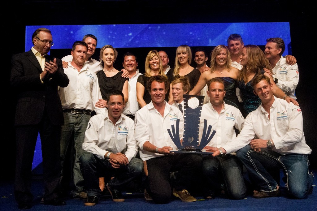 Jean-Claude Delen, CEO Benelux & France, DHL Global Forwarding, presents the Team Sanya Shore Crew, with the DHL Shore Crew award for the Volvo Ocean Race 2011-12, at the Prize Giving Ceremony in Galway, Ireland, during the Volvo Ocean Race 2011-12.  © Ian Roman/Volvo Ocean Race http://www.volvooceanrace.com