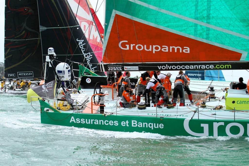 Groupama&rsquo;s crew work hard to keep an edge on the boats stacked to windward - Volvo Ocean Race Auckland - Start March 18,2012 photo copyright Richard Gladwell www.photosport.co.nz taken at  and featuring the  class