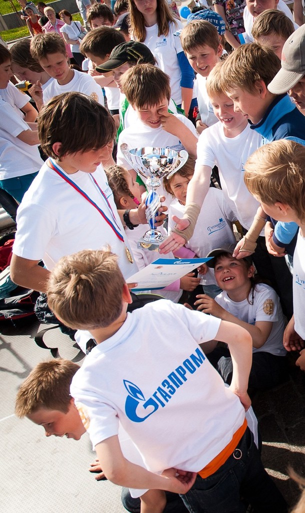 Bogdan Golovnin shows his winning Gazprom Trophy to the other 70 youth entrants © SPBYC 2012.jpg	Bogdan Golovnin shows his winning Gazprom Trophy to the other 70 youth entrants  - Gazprom Cup 2012 photo copyright Yacht Club of Saint-Petersburg 2012 taken at  and featuring the  class