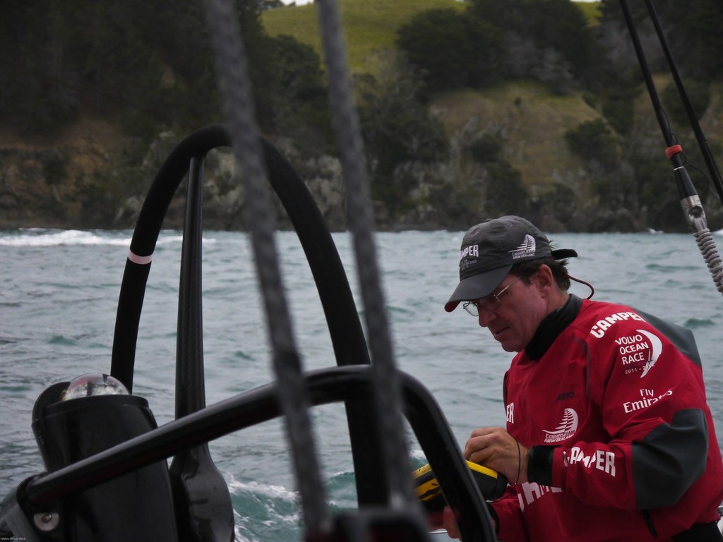 Will Oxley guiding the boat through a narrow gap in the islands of the Hauraki Gulf onboard CAMPER with Emirates Team New Zealand during leg 5 of the Volvo Ocean Race 2011-12, from Auckland, New Zealand to Itajai, Brazil (Credit: Hamish Hooper/CAMPER ETNZ/Volvo Ocean Race) photo copyright Hamish Hooper/Camper ETNZ/Volvo Ocean Race taken at  and featuring the  class
