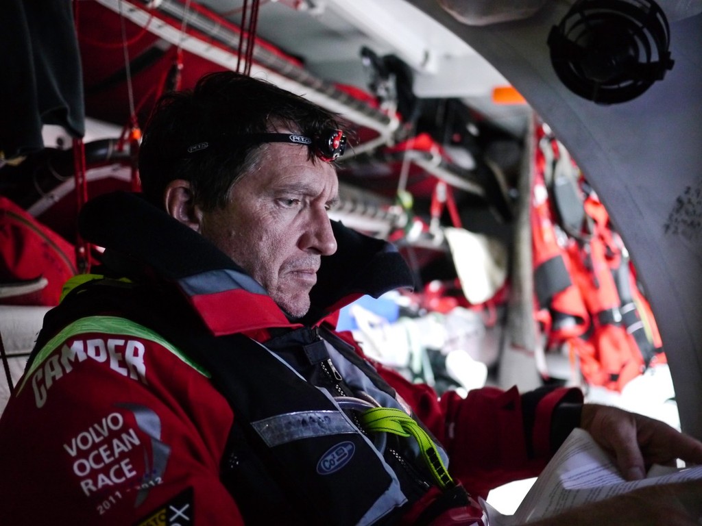 Will Oxley receives advice on the repair work needed on the forward bulkhead, onboard Camper during leg 5 of the Volvo Ocean Race 2011-12, from Auckland, New Zealand to Itajai, Brazil.  © Hamish Hooper/Camper ETNZ/Volvo Ocean Race