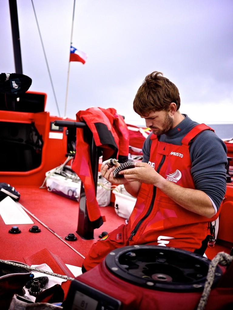 Mike Pammenter continues maintenance work, after CAMPER with Emirates Team New Zealand leaves Puerto Montt, Chile, during leg 5 of the Volvo Ocean Race 2011-12, from Auckland, New Zealand to Itajai, Brazil. (Credit: Hamish Hooper/CAMPER ETNZ/Volvo Ocean Race) photo copyright Hamish Hooper/Camper ETNZ/Volvo Ocean Race taken at  and featuring the  class