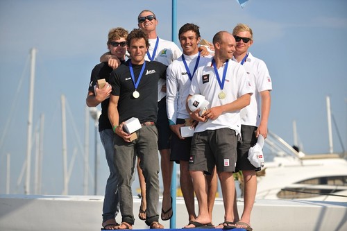 Podium winners: NZL in black, AUS in white middle, DEN in white, right  - 49 World Championship 2012 © Nikola Sisko