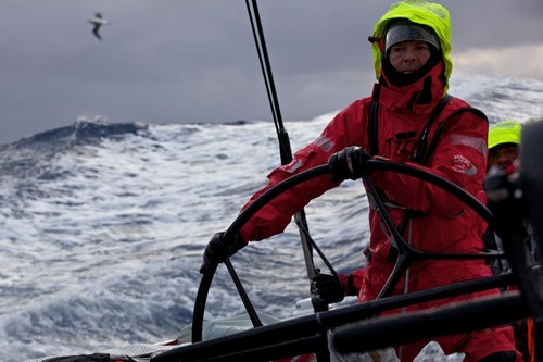 Thomas Johanson drives in the Southern Ocean swell with a passing an albatross in the distance. Puma Ocean Racing during leg 5 of the Volvo Ocean Race 2011-12, from Auckland, New Zealand, to Itajai, Brazil.  © Amory Ross/Puma Ocean Racing/Volvo Ocean Race http://www.puma.com/sailing