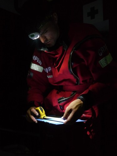 Mike Pammenter measures up some carbon fibre plates for repairing the forward bulkhead onboard Camper during leg 5 of the Volvo Ocean Race 2011-12, from Auckland, New Zealand to Itajai, Brazil.  © Hamish Hooper/Camper ETNZ/Volvo Ocean Race