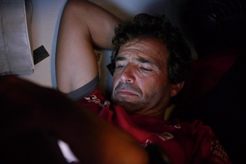 Roberto Bermudez De Castro, checking an email delivered onboard Camper sailed by Emirates Team New Zealand during leg 6 of the Volvo Ocean Race 2011-12, from Itajai, Brazil, to Miami, USA.  © Hamish Hooper/Camper ETNZ/Volvo Ocean Race
