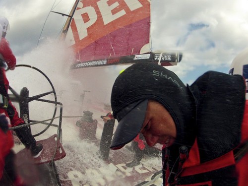 Nick Burridge squints away from the wall of white water onboard Camper with Emirates Team New Zealand during leg 8 of the Volvo Ocean Race 2011-12, from Lisbon, Portugal to Lorient, France.  © Hamish Hooper/Camper ETNZ/Volvo Ocean Race