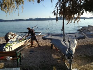 2 x NZL boats in Zadar. Marcus and Josh putting their mast back up after measurement photo copyright Peter Burling and Blair Tuke taken at  and featuring the  class