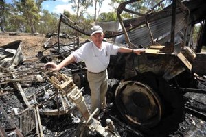 Remembering the bad times - club member stands amid burnt out remains of the club photo copyright  SW taken at  and featuring the  class