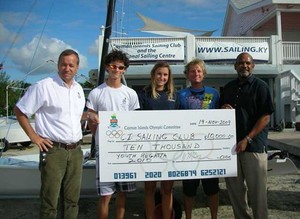 A handsome cheque indeed! CISC Members, Commodore Andrew Moon, Athlete Chris Delaney, Athlete Marina Maffessanti and Mike Weber Director of Sailing receive a much appreciated cheque from Donald McLean, President of the Cayman Islands Olympic Committee. This is a wonderful example of how some of the smaller nations 
of the world are throwing their full support behind the first-ever Youth Olympic Games to be held in August this year in Singapore. photo copyright Byte Class http://bytechamps.org/ taken at  and featuring the  class