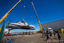 The Brigitte Bardot is hoisted by cranes from its repair site to the water photo copyright Simon Ager taken at  and featuring the  class