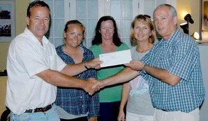 Cayman Islands Sailing Club represented by Andrew Moon, Commodore, Katrina Davis CISC Coach, Peta Adams CISC Race Officer and Jane Moon, Event Organizer receive a sponsorship cheque from John Bodden, Representative of the Water Authority - Cayman. photo copyright Byte Class http://bytechamps.org/ taken at  and featuring the  class