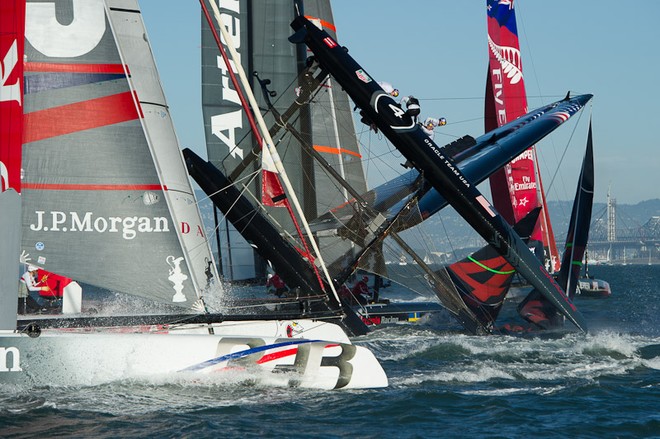 Oracle Team USA digs the bows in and capsizes at the first mark in the first fleet race of day four of the America’s Cup World Series, San Francisco  ©  SW