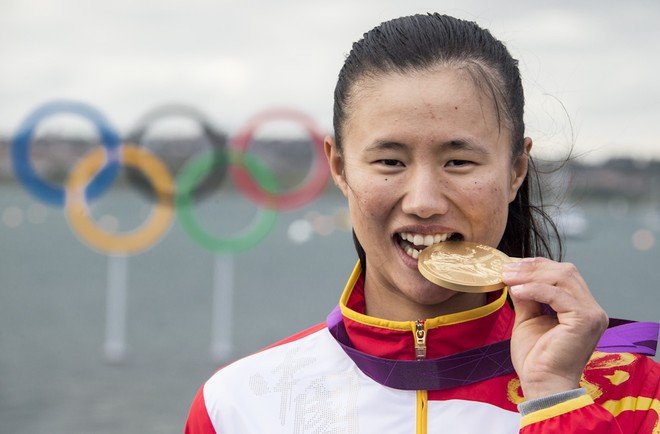 Lijia Xu tastes Gold - day 9 Medal race - Laser Radial. London Olympics 2012 © Carlo Borlenghi/FIV - copyright
