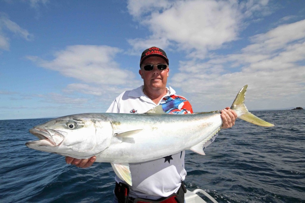 Jasons displays a solid kingfish from 60 meters of water. © Jarrod Day