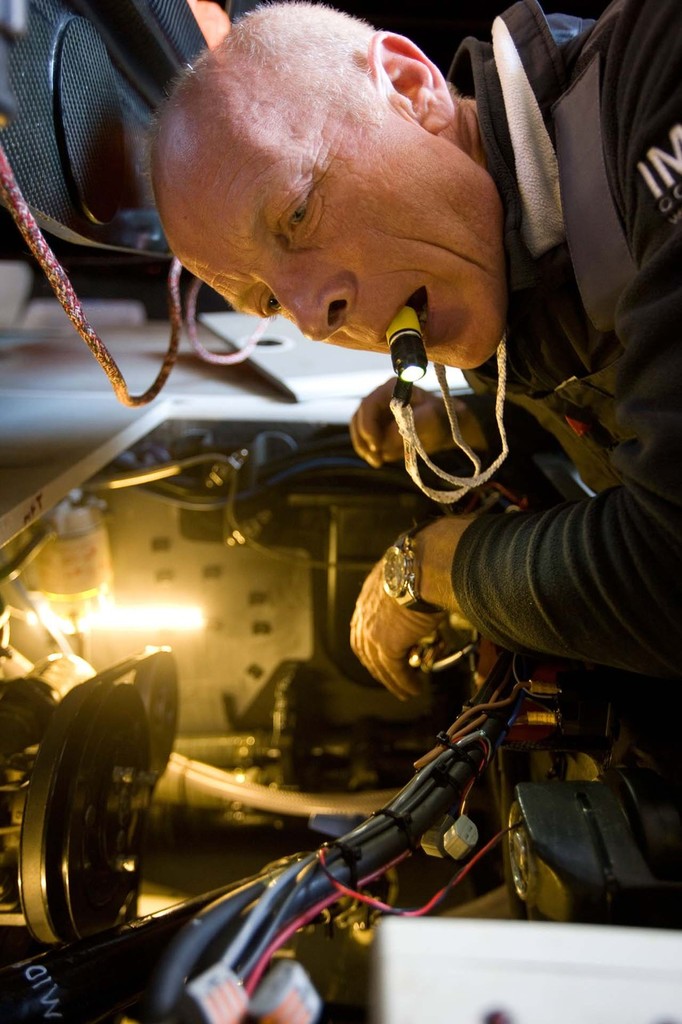 Mike Golding using the handy XS micro torch as he works below decks on Gamesa in the Vendee Globe 2012. photo copyright Exposure Marine http://www.exposuremarine.com taken at  and featuring the  class