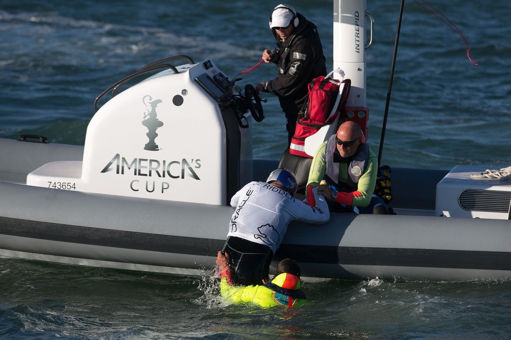 Crew are retrieved after Oracle Spithill pitchpoles at the first mark of the fleet racing on Day 4 of the America’s Cup World Series photo copyright ACEA - Photo Gilles Martin-Raget http://photo.americascup.com/ taken at  and featuring the  class