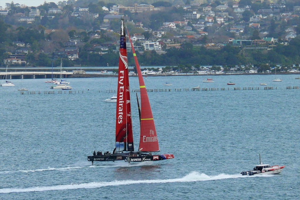 5 - AC72 - New Zealand fully lifted on her L-Foils and sailing on the Waitemata Harbour, Auckland, New Zealand. The windward L-foil is shown clear of the water in compliance with AC racing rules. photo copyright Swan Images http://www.sail-world.com taken at  and featuring the  class