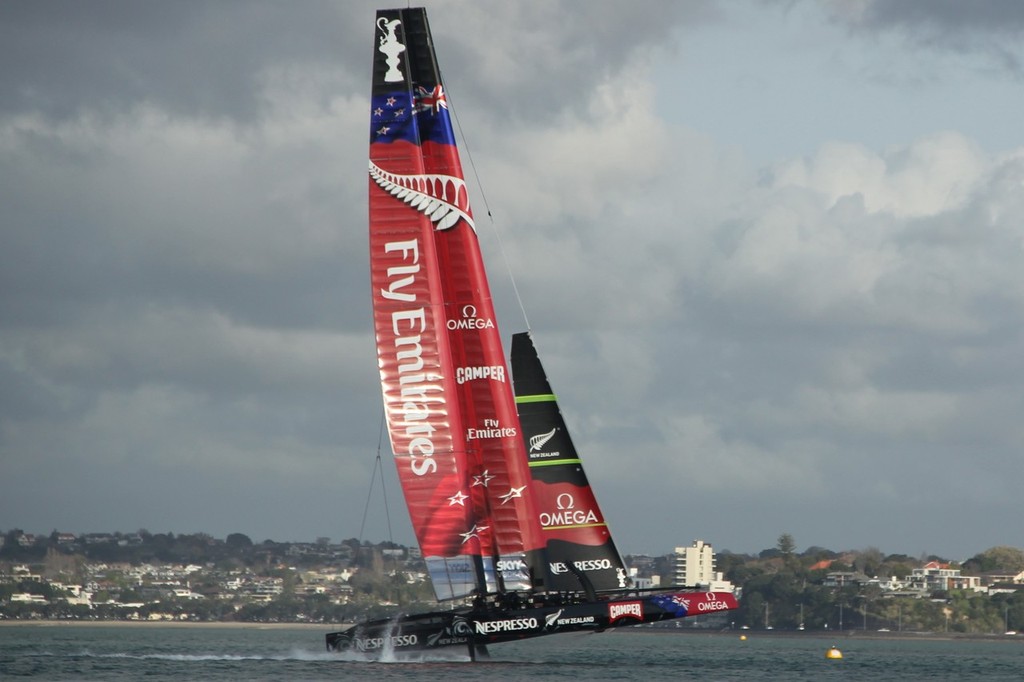 1 - Emirates Team NZ - AC72 - rears slightly experiencing an increase in windstrength off North Head  September 6, 2012 photo copyright Wright Images http://www.sail-world.com taken at  and featuring the  class