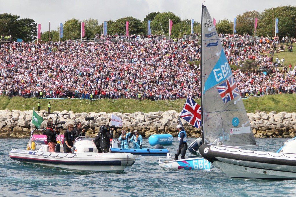  August 5, 2012 - Weymouth, England - Ainslie salutes the crowd after winning the Gold Medal in the Finn class photo copyright Richard Gladwell www.photosport.co.nz taken at  and featuring the  class