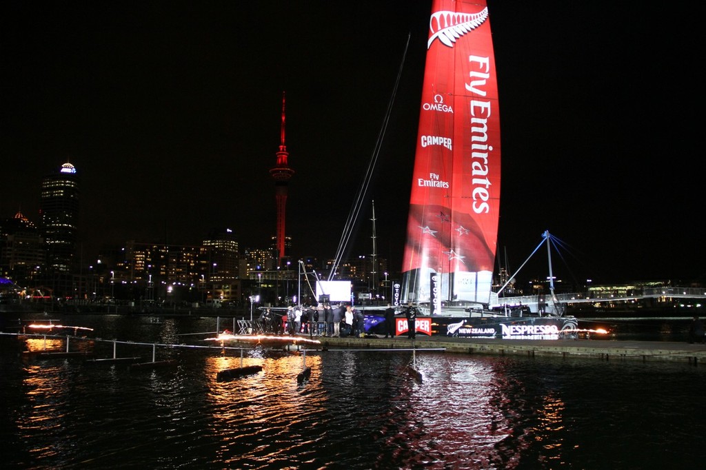 July 21, 2012 America's Cup - Emirates Team NZ Launch at the Viaduct Harbour, Auckland. Emirates Team NZ's AC72 is surrounded by fire. photo copyright Richard Gladwell www.photosport.co.nz taken at  and featuring the  class
