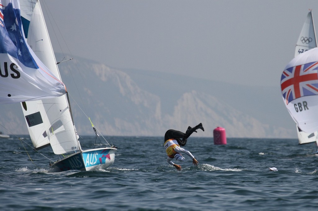  August 10, 2012 - Weymouth, England - Mathew Belcher does a back flip off the Australian Mens 470 celebrating their Gold Medal win - the Silver Medalist (GBR) are yet to finish © Richard Gladwell www.photosport.co.nz