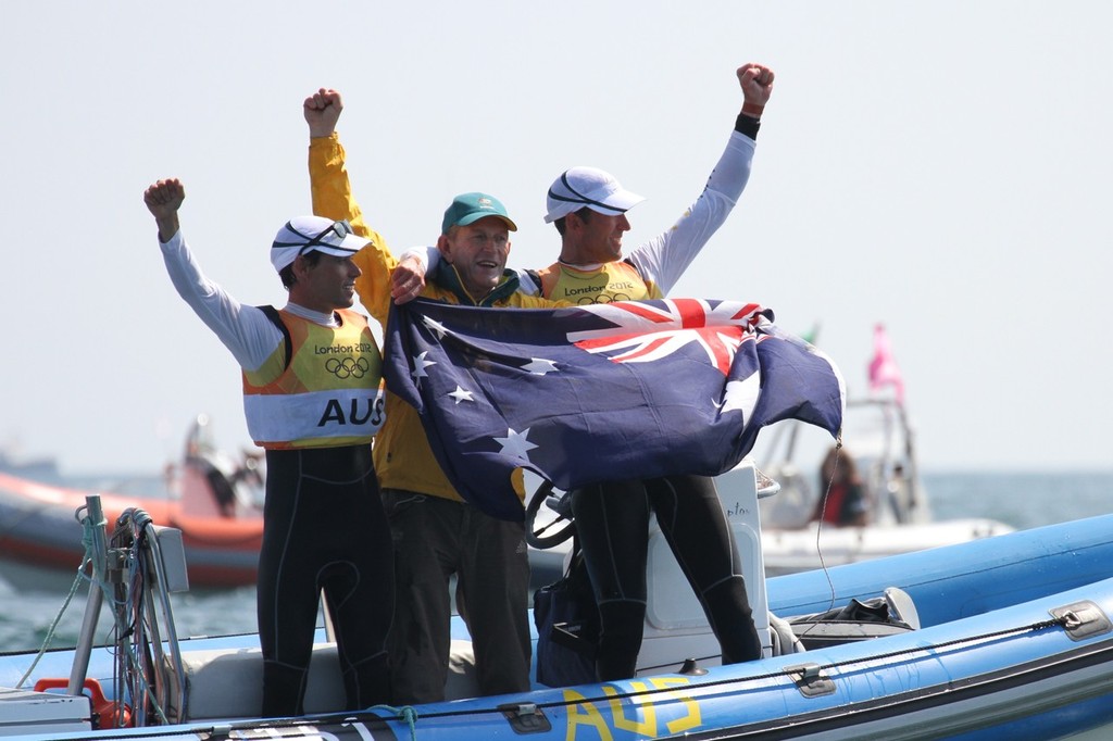 Mathew Belcher and Malcom Page celebrating their Gold Medal win in the Mens 470 - with coach Victor Kovalenko - his sixth Olympic Gold as a coach photo copyright Richard Gladwell www.photosport.co.nz taken at  and featuring the  class