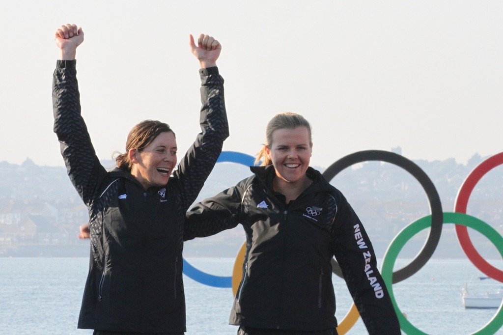  August 10, 2012 - Weymouth, England - Jo Aleh and Olivia Powrie step up on the podium before being presneted with their Olympic Gold Medal for the Womens 470 photo copyright Richard Gladwell www.photosport.co.nz taken at  and featuring the  class
