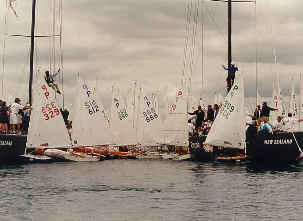 Selling the Dream - P-class gathered around Team NZ’s America’s Cup boats in 2000 photo copyright Powrie Images taken at  and featuring the  class