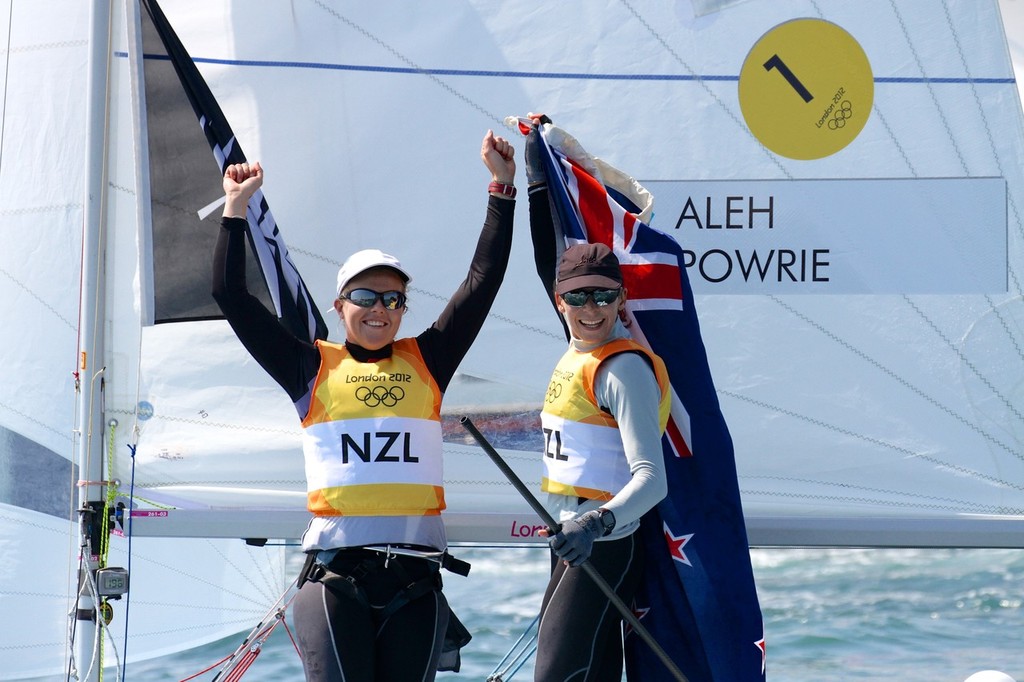 Olivia Powrie and Jo Aleh salute the Nothe crowd soon after winning the Gold Medal at Weymouth in August 2012. © Richard Gladwell www.photosport.co.nz