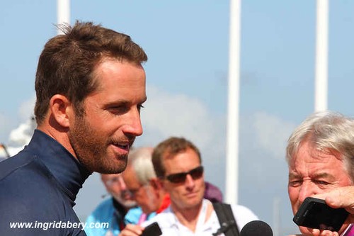 Olympic gold medallist Ben  Ainslie speaking to the press in the Mixed Zone after winning his gold medal.. © Ingrid Abery http://www.ingridabery.com
