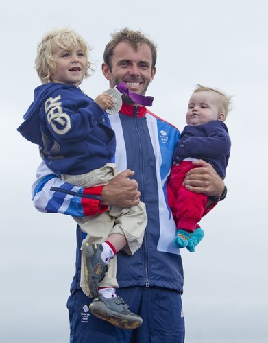 Nick Dempsey (GBR) (the proud Dad) who won the Silver Medal today, 07.08.12, in the Medal Race Men’s Windsurfer (RSX) event in The London 2012 Olympic Sailing Competition. © onEdition http://www.onEdition.com