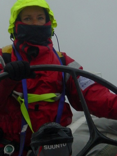 Bridget Suckling at the helm in heavy weather gear on Amer Sports Too © Volvo Ocean Race http://www.volvooceanrace.com