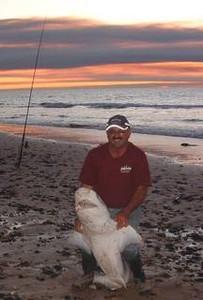 The author with a seven gilled shark from the beach. photo copyright Carl Hyland taken at  and featuring the  class