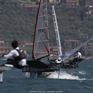 12_17357  ©Th.Martinez/Sea&Co.  CAMPIONE DEL GARDA - ITALY . 23 August  2012 . 
2012 ZHIK NAUTICA MOTH WORLDS. Day 5.
02-Joe Turner(AUS2) capzising front of  06- John Harris (AUS6) at top mark.
 photo copyright Th Martinez.com http://www.thmartinez.com taken at  and featuring the  class